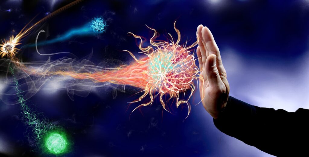 a hand is held up against images of virus cells coming towards it
